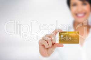 Composite image of happy businesswoman showing a creditcard