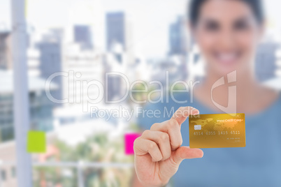 Happy businesswoman showing a creditcard