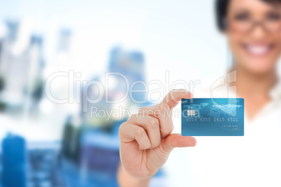 Happy businesswoman showing a creditcard