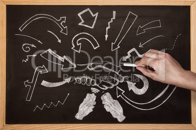 Composite image of hand writing with chalk