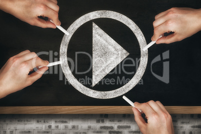 Composite image of multiple hands writing with chalk