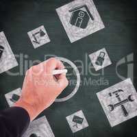 Composite image of business man writing with chalk