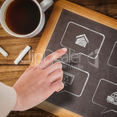 Composite image of businesswoman pointing