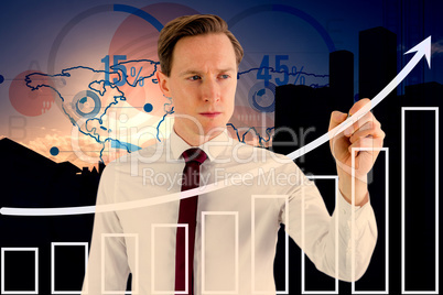 Composite image of businessman writing something with chalk