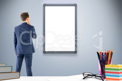 Composite image of wear view of businessman thinking