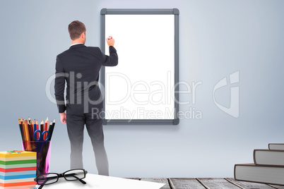 Composite image of business man writing with chalk