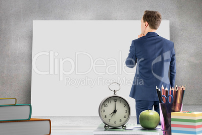 Composite image of wear view of businessman thinking