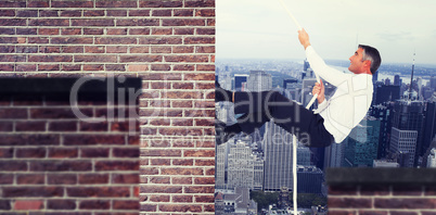 Composite image of businessman pulling rope while sitting on cube