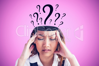 Composite image of nervous businesswoman holding her head