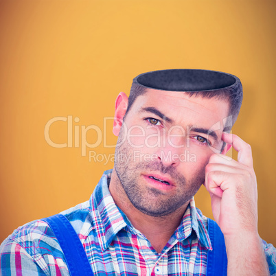 Composite image of portrait of confused manual worker scratching head