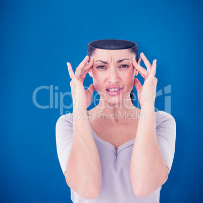 Composite image of brunette suffering from migraine