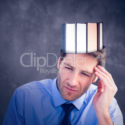 Composite image of stressed businessman holding his head