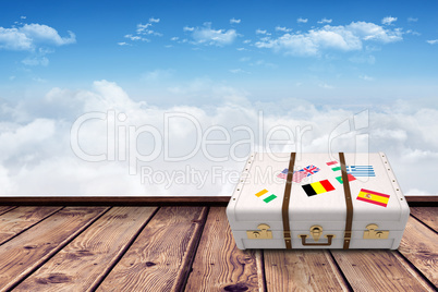 Composite image of suitcase with stickers