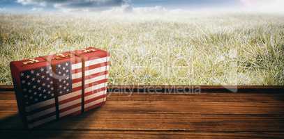 Composite image of usa flag suitcase