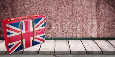 Composite image of great britain flag suitcase