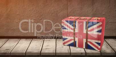 Composite image of great britain flag suitcase