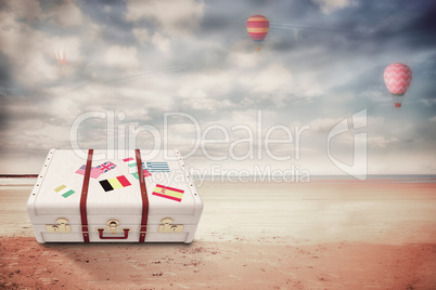 Composite image of suitcase with stickers