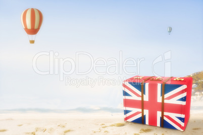 Composite image of great britain flag suitcase