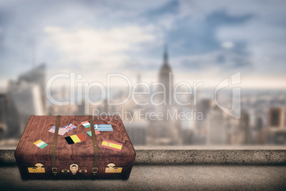 Composite image of suitcase with stickers