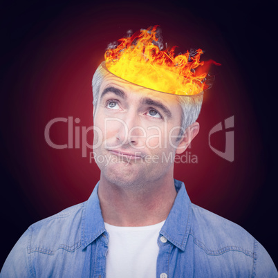 Composite image of confused man with grey hair thinking