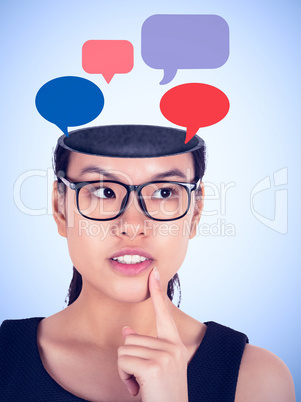 Composite image of thinking businesswoman wearing glasses