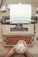 Curriculum vitae against above view of old typewriter