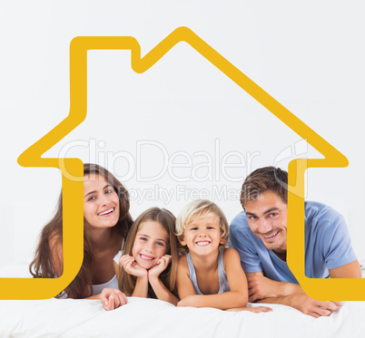 Composite image of happy family lying on a bed