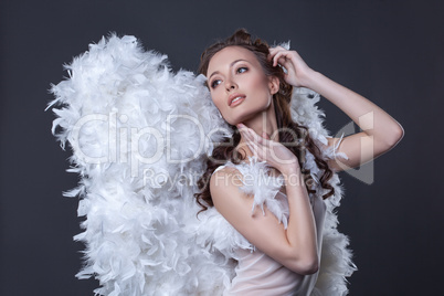 Image of lovely woman in angel costume with wings
