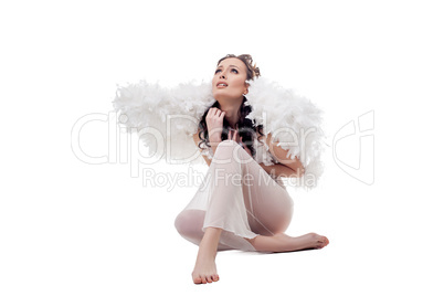 Sad woman in angel costume. Isolated on white