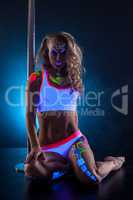 Sexy dancer with spectacular glowing bodyart