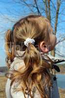 little girl with a lot of braides