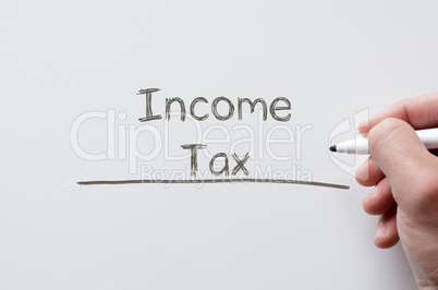 Income tax written on whiteboard