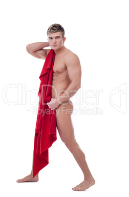Handsome young guy covers his nakedness with cloth