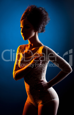 Studio shot of underwear model posing in spotlight