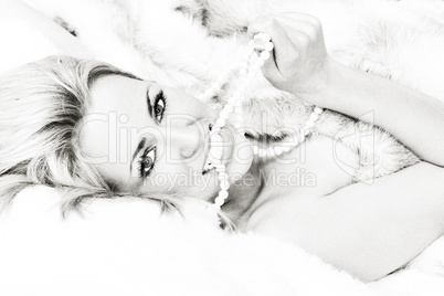 Black and White Beautiful Woman in Fur and Pearl Necklace