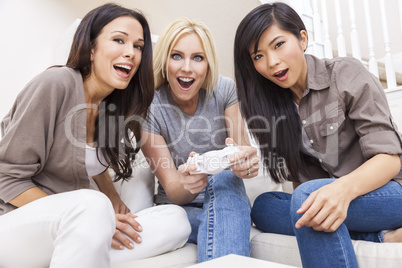 Three Beautiful Women Friends Playing Video Games at Home