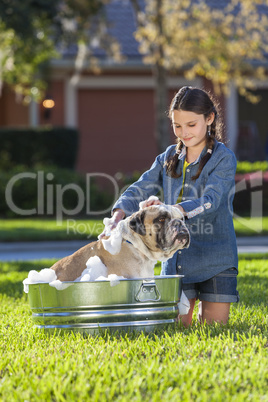 Girl Child Washing Her Pet Dog In A Tub
