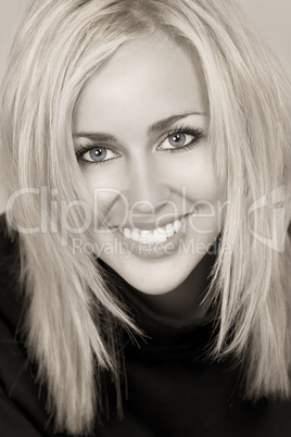 Beautiful Happy Young Blond Woman With Perfect Teeth and Smile