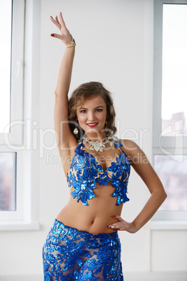 Belly dancer in costume embroidered with sequins