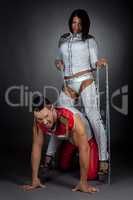 Dance show. Imperious woman and guy in chains