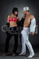 Striptease show. Passionate couple poses at camera