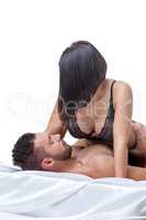 Photo of man passionately hugs brunette in bed