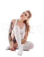 Photo of attractive girl with tattoos on her body