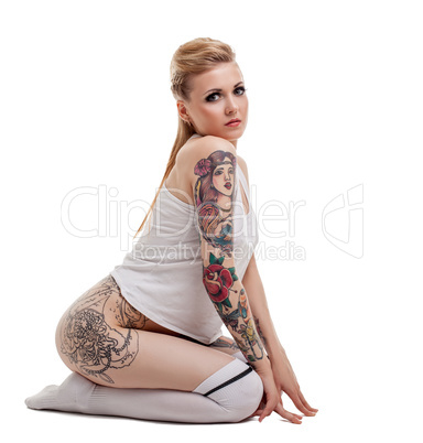 Image of beautiful young woman with tattooed body