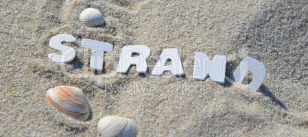 Strand Buchstabend im Sand Urlaub