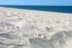 Strand Buchstabend im Sand Urlaub