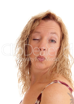 Woman blowing a kiss.