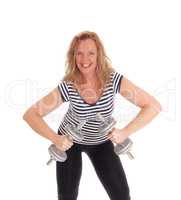 Middle age woman workout with dumbbells.
