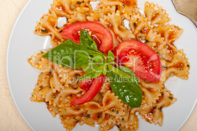 Italian pasta farfalle butterfly bow-tie and tomato sauce