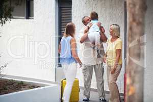 Grandfather greeting his young grandchild